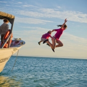 IH kids jumping off boat 9x6